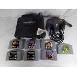 Nintendo - an unboxed Nintendo 64 game console with one controller and seven unboxed game
