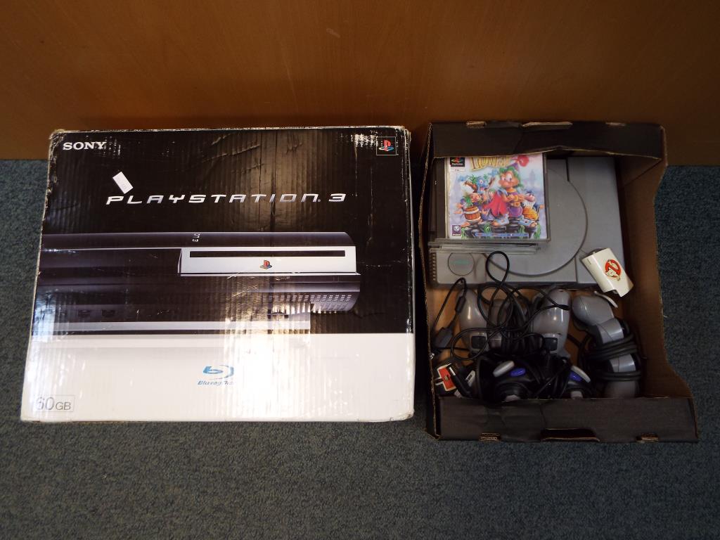Playstation - a Sony Playstation console with two controllers,