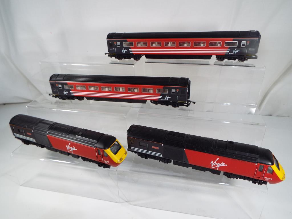Model Railways - a Hornby Virgin four car unit comprising locomotive, dummy unit and two carriages,