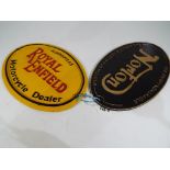 Two oval cast iron motorcycle wall plaques entitled Royal Enfield and Norton.