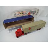 Dinky Supertoys - a diecast Tractor-Trailer unit McLean with windows in red cab and opening rear