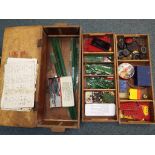 Meccano - A wooden box containing a quantity of vintage Meccano comprising plates, strips, motors,