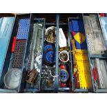 Meccano - a metal tool box containing a quantity of Meccano construction pieces to include plates,