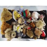 Teddy bears - a box containing a quantity of teddy bears and cuddly toys.