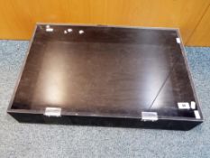 A wooden display case with clear plastic hinged lid,
