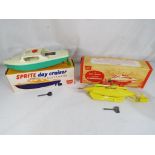 Sutcliffe Models - Two Sutcliffe Models tinplate clockwork models comprising a 'Sprite' Day Cruiser,