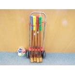 A croquet set with transportable trolley and balls (2)