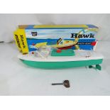 Sutcliffe Models - A Sutcliffe Models 'Hawk' tinplate clockwork speedboat with green hull,