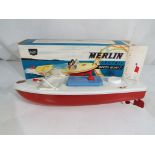 Sutcliffe Models - A Sutcliffe Models 'Merlin' electric speedboat tinplate model with red hull,