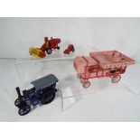 Four diecast models comprising a kit built Threshing machine bearing 'Ransomes' livery,