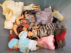 Dolls - a box containing approximately 35 dolls predominantly souvenir dolls and similar