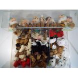 Ty Bears - a display case containing a quantity of Ty Beanie Babies and a set of Disney Seven