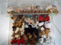 Ty Bears - a display case containing a quantity of Ty Beanie Babies and a set of Disney Seven