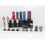 A small collection of mid 20th century diecast metal road signs, Essolube motor oil cabinet,