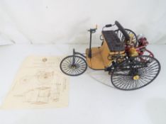 Franklin Mint - a Franklin Mint diecast model of the 1886 Benz Patent Motorwagen in 1:8 scale,