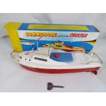Sutcliffe Models - A Sutcliffe Models 'Commodore' tinplate clockwork cruiser with red hull,