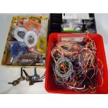 Model Railways - three boxes containing a quantity of cables, switches,