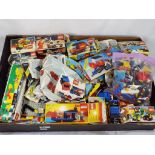 Lego - a tray of boxed and unboxed Lego building bricks with some empty original boxes,