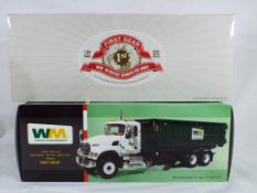 First Gear - two 1:34 scale diecast trucks in original boxes, excellent to mint condition.