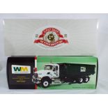 First Gear - two 1:34 scale diecast trucks in original boxes, excellent to mint condition.