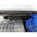 Model Railways - a box containing a quantity of Hornby OO gauge track also containing points and