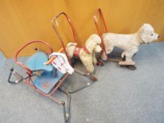 Two vintage push-along dogs and a vintage bouncing rocking horse