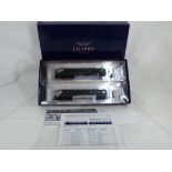 Model Railways - a Lilliput HO scale two-car diesel/electric rail car set in German DR green livery,