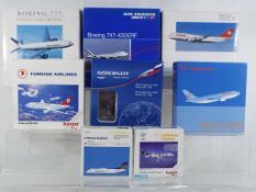 Herpa - a collection of eight boxed model aircraft in various scales,