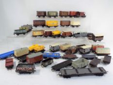 Model Railways Hornby OO gauge - in excess of 40 unboxed wagons in playworn condition.