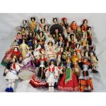 Forty unboxed international dolls, all clothed, approximately 18.