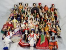 Forty unboxed international dolls, all clothed, approximately 18.