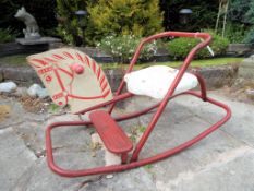A child's vintage Triang rocking horse with red steel frame This lot MUST be paid for and