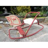 A child's vintage Triang rocking horse with red steel frame This lot MUST be paid for and