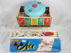 Vintage toys - a Gyro powered spaceship by Marx and a wooden plane in kit form by Ace,