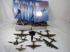 Orbis and De Augustina - a collection of aviation items comprising twelve diecast planes, unboxed,