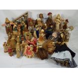 Approximately 45 dolls predominantly made of corn husk and some made of wicker,