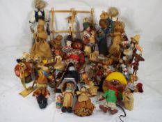 Approximately 44 dolls predominantly made of corn husk, some with stands,