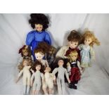 Eleven modern dolls,