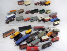 Model Railways Hornby OO gauge - in excess of 40 unboxed wagons in playworn condition.
