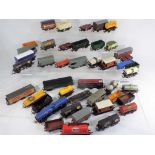 Model Railways Hornby OO gauge - in excess of 40 unboxed wagons in playworn condition.