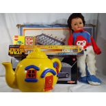 A selection of children's toys to include a boxed bar football table, a giant plastic teapot,