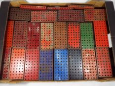 Meccano - in excess of 160 flanged plates various colours including red, blue,
