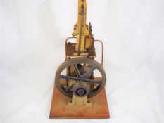 A scratch built vertical miniature steam pump on a plinth, approx 38cm (h) with steel,