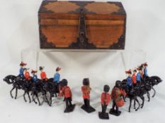 Britains and Lone Star - Fourteen lead and plastic soldiers, mainly on horseback,