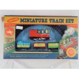 A battery powered miniature train set by Trans Pacific Ltd, set contains a steam loco,