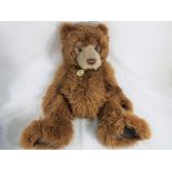 Charlie Bears - a large Charlie Bear with bells, stitched nose and joints arms and legs,
