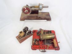 Four scratch built horizontal miniature steam pumps two on wooden plinths the other on a metal