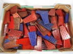 Meccano - in excess of 150 triangle flanged plates, also includes some blue and ashed gold pieces,