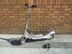 An electric powered scooter marked 'Freestyle' with charger (untested)- This lot MUST be paid for