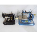 Vulcan - Two miniature vintage sewing machines in very good to near mint condition.